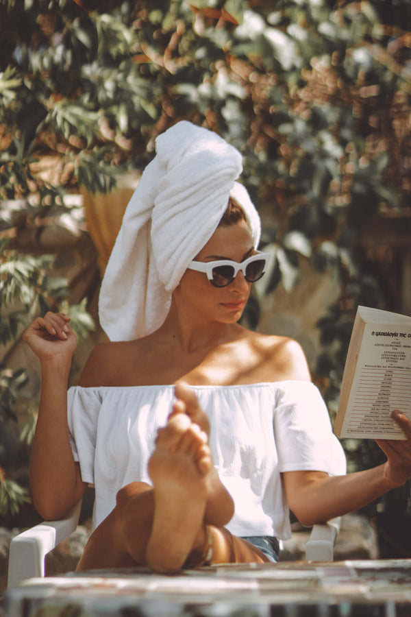 LALO Skincare - Woman reading book
